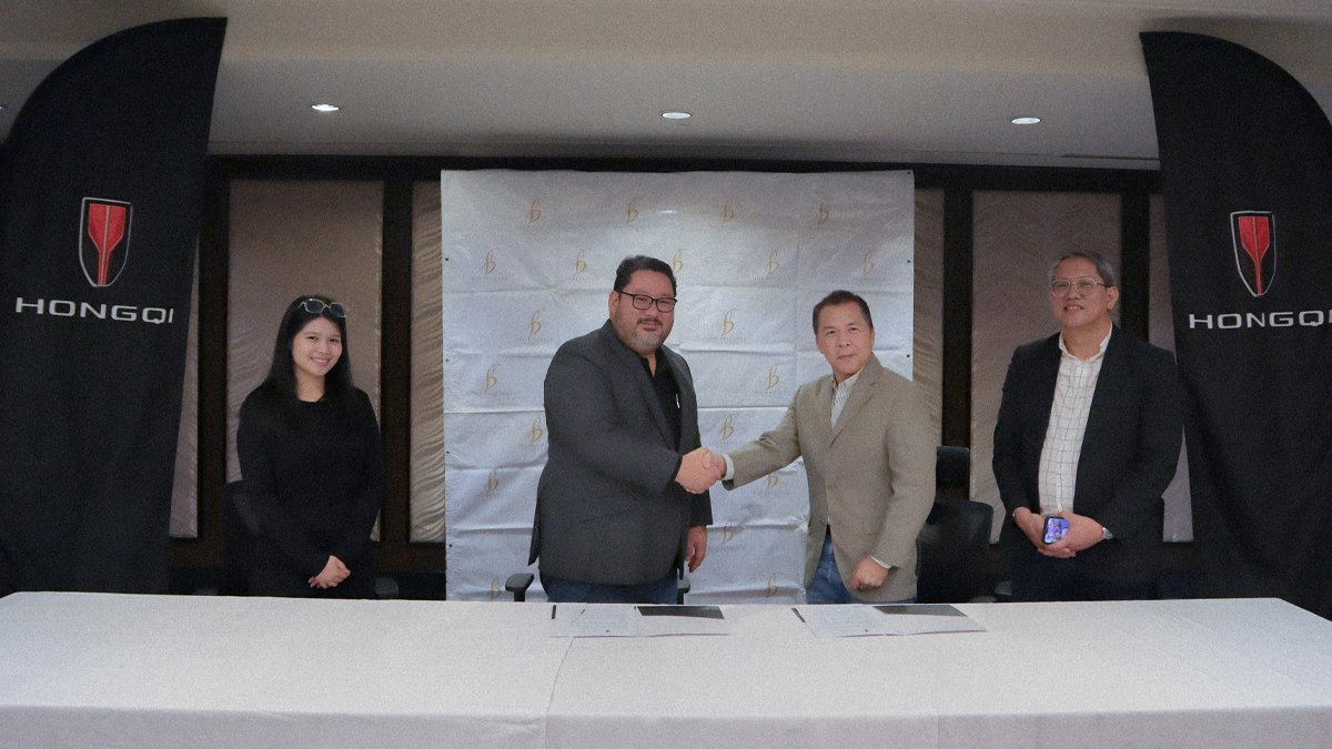 Justine Delacerna, Assistant Director for Group Marketing of The Bellevue Manila; John Patrick Chan, Managing Director of The Bellevue Manila; David Zaballero, Vice President and General Manager of Hongqi Philippines; and Brian Badilla, Sales and Marketing Head of Hongqi Philippines, sealing the partnership with a ceremonial handshake during the signing.
