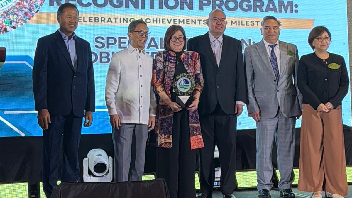 Representatives from Monde Nissin Corporation receive a Special Citation for Obliged Enterprises